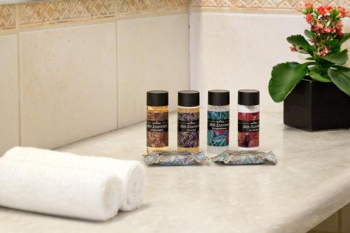 three bottles of mascara sitting on a bathroom counter at The Stanley in Athens