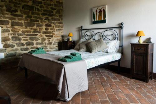 Una cama o camas en una habitación de Le Terre di Caprano