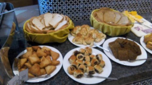 a group of plates of food on a table at Royal Court Hotel in Mombasa