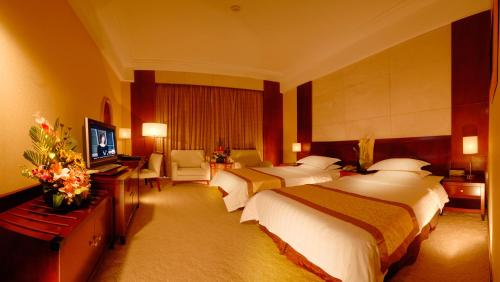 Cama ou camas em um quarto em Jiangxi Grand Hotel Beijing