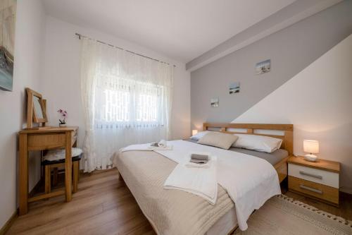 Postel nebo postele na pokoji v ubytování Vila Marija