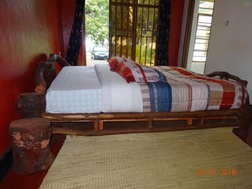 Kivu Beach Garden 객실 침대