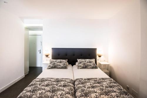 Postel nebo postele na pokoji v ubytování La Grand Suite Las Canteras