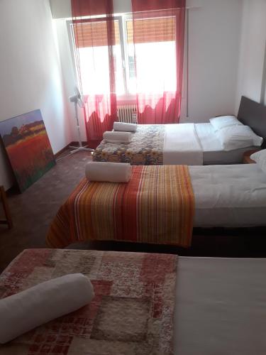 Ένα ή περισσότερα κρεβάτια σε δωμάτιο στο Venice Holiday