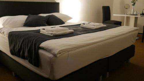 Cama o camas de una habitación en Hotel Bílý Koníček