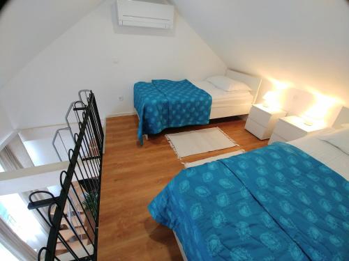 Postel nebo postele na pokoji v ubytování Hotel garni Paleta