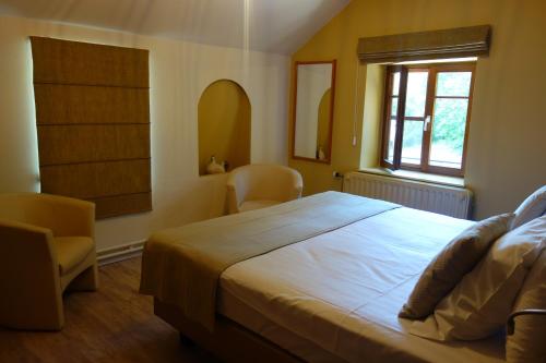 Ένα ή περισσότερα κρεβάτια σε δωμάτιο στο La Clochette