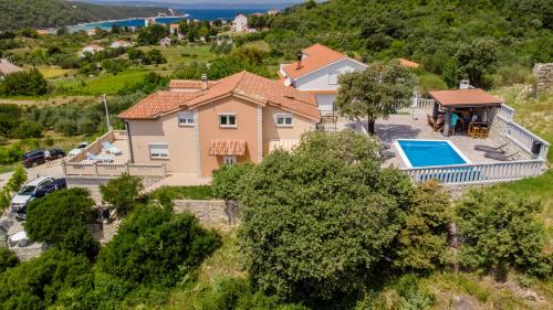 an aerial view of a house with a swimming pool at Vila Marija in Rab