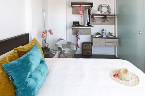 a bedroom with a bed with a hat on it at Beyond Amadores C&H Suite in Amadores