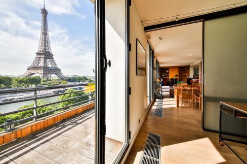 a room with a view of the eiffel tower at Eiffel Terraces in Paris
