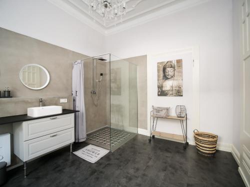 a bathroom with a shower and a sink at City Apartments Siegburg Studios in Siegburg
