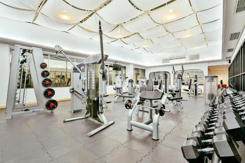 a gym with treadmills and cardio machines at Barceló Mexico Reforma in Mexico City