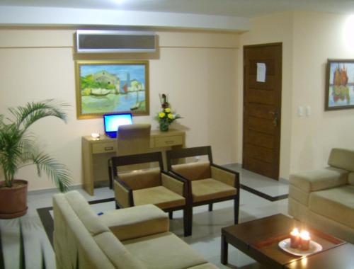 Un lugar para sentarse en Don Limpone Apart Hotel