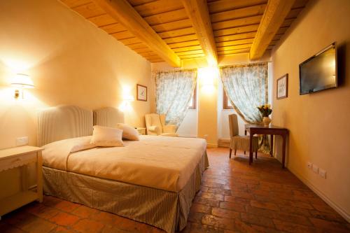 En eller flere senger på et rom på Antico Casale Bergamini