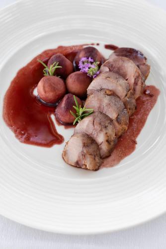a plate of food with meat and potatoes on a plate at Momentum Wellness Bioresort in Marinella di Selinunte
