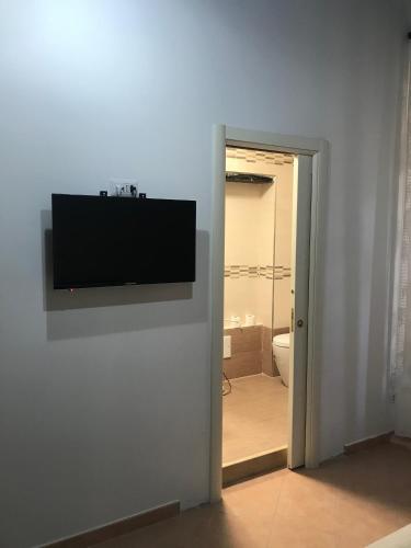 TV a/nebo společenská místnost v ubytování B&B Pozzo dei Desideri
