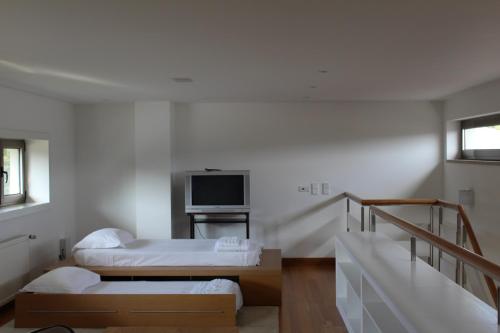 Ένα ή περισσότερα κρεβάτια σε δωμάτιο στο Casa de Coyra