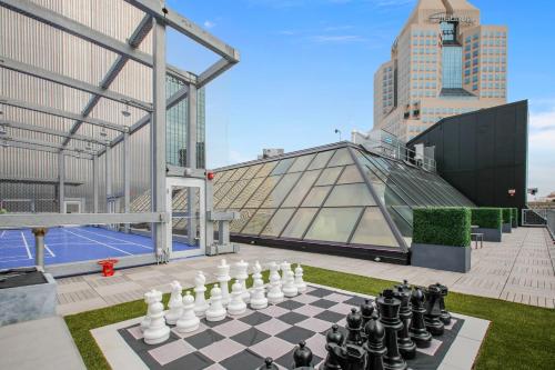 a chess board in front of a glass building at Etage Executive Living in Pittsburgh