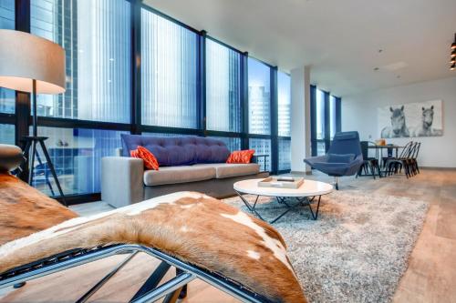 a living room with a couch and a table at Etage Executive Living in Pittsburgh