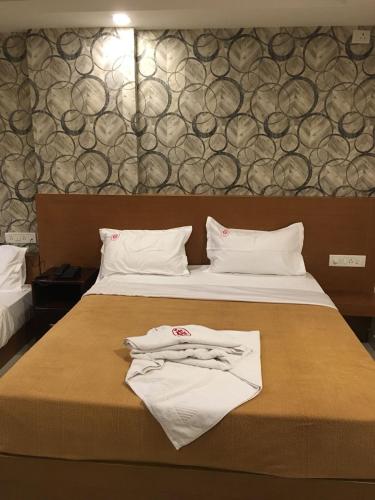 Hotel Grand Suitesにあるベッド