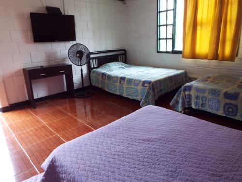 Katil atau katil-katil dalam bilik di Finca El Recreo - El Descanso