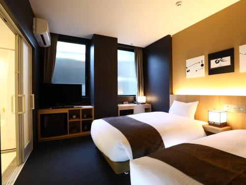 Postel nebo postele na pokoji v ubytování Hotel Wing International Kyoto - Shijo Karasuma