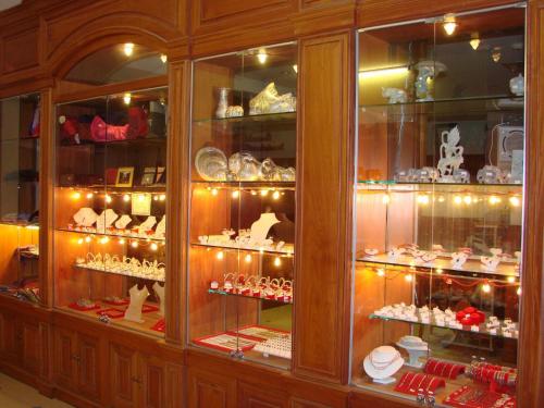 a display case in a store filled with dishes at City River Hotel in Siem Reap