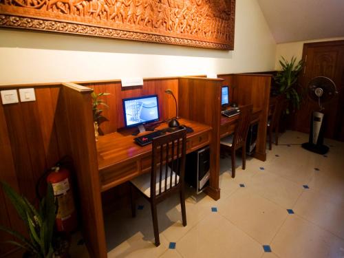 an office with a desk with a computer on it at City River Hotel in Siem Reap