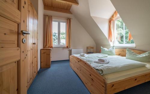 Postel nebo postele na pokoji v ubytování Appartement-Hotel-Anlage Tannenpark