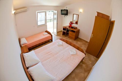 Postel nebo postele na pokoji v ubytování Apartments Stanka