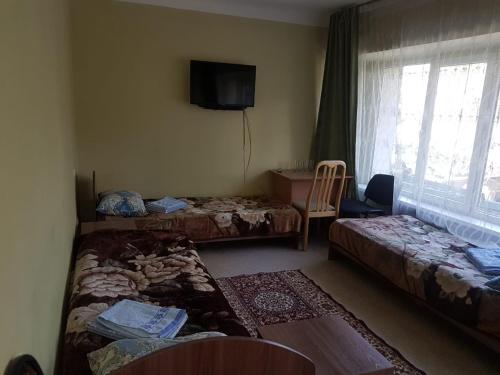 Ένα ή περισσότερα κρεβάτια σε δωμάτιο στο Hotel Kezdesu