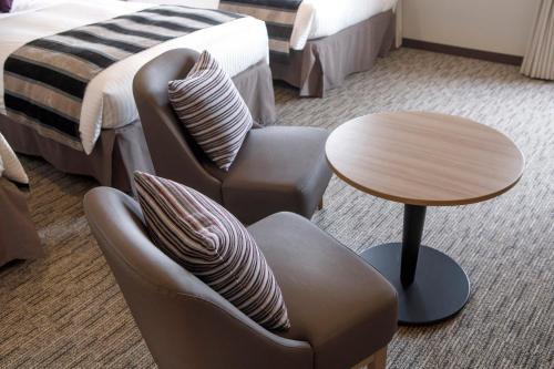 Ένα ή περισσότερα κρεβάτια σε δωμάτιο στο HOTEL MYSTAYS Hakodate Goryokaku