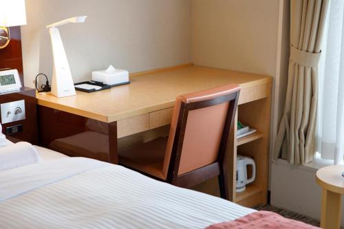 Ένα ή περισσότερα κρεβάτια σε δωμάτιο στο HOTEL MYSTAYS Hakodate Goryokaku