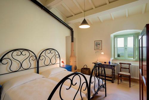 Ένα ή περισσότερα κρεβάτια σε δωμάτιο στο Agriturismo Le Tassinaie