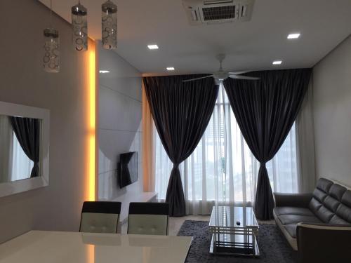 Coin salon dans l'établissement Soho Suites KL City Centre