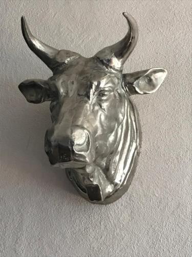 a metal animal head with horns on a wall at Hotel an der Burg in Gießen