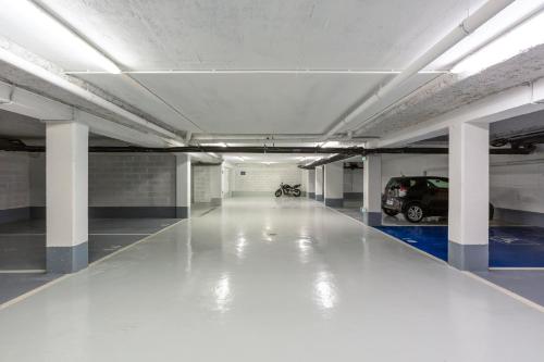 an empty parking garage with a car parked in it at ibis budget Paris Clichy Mairie in Clichy