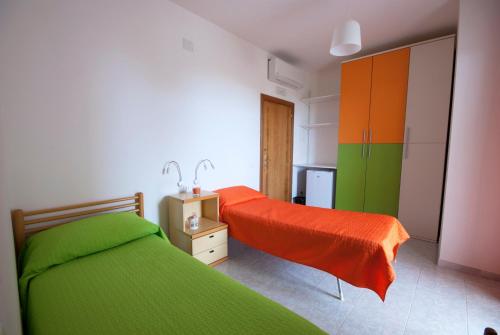 A bed or beds in a room at B&B Tra gli ulivi