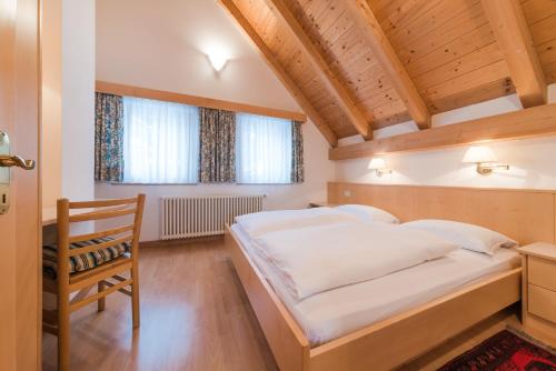 Krevet ili kreveti u jedinici u objektu Residence Chalet Pinis