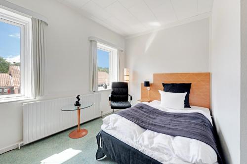 Giường trong phòng chung tại Hotel Jernbanegade