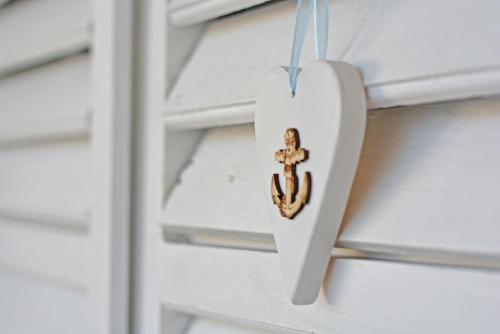a heart shaped ornament hanging on a door at ꕥ ROOMS SUNCE, Family choice, Best Panoramic view, Supetar Island Brac in Supetar