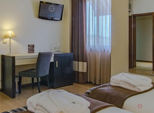 Ένα ή περισσότερα κρεβάτια σε δωμάτιο στο Your Hotel & Spa Alcobaça