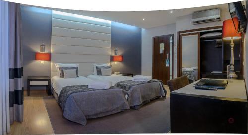 Ένα ή περισσότερα κρεβάτια σε δωμάτιο στο Your Hotel & Spa Alcobaça