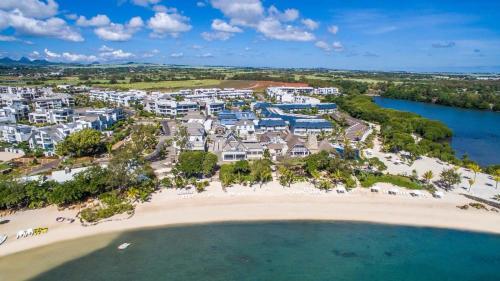 an aerial view of the resort and the beach at AZURI Serviced Garden Apartment in Roches Noires