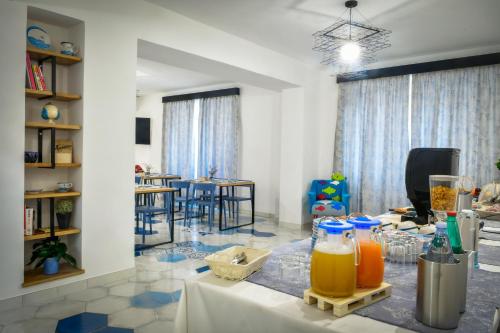 a room with a table with two bottles of orange juice at Big Rose in Rossano