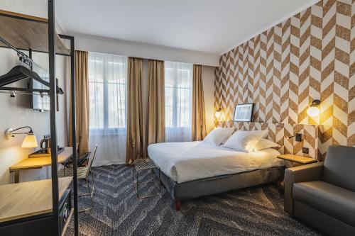 a hotel room with a bed and a couch at Best Western Hotel Centre Reims in Reims