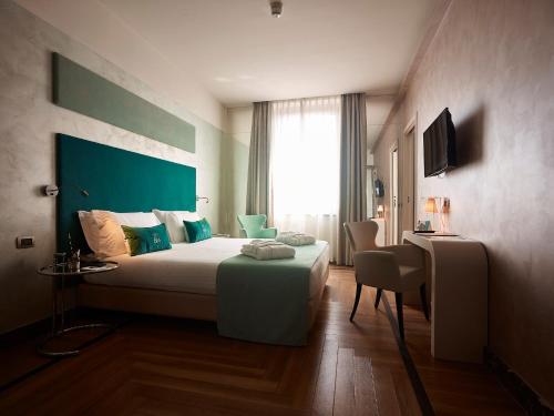 a hotel room with a bed and a window at Bianca Maria Palace Hotel in Milan