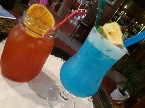 a drink sitting on a table next to a drink at Hotel Gioiella Depandance in Bellaria-Igea Marina