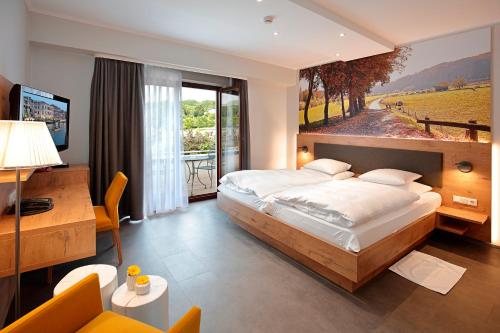 Postel nebo postele na pokoji v ubytování Hotel - Restaurant DAHM