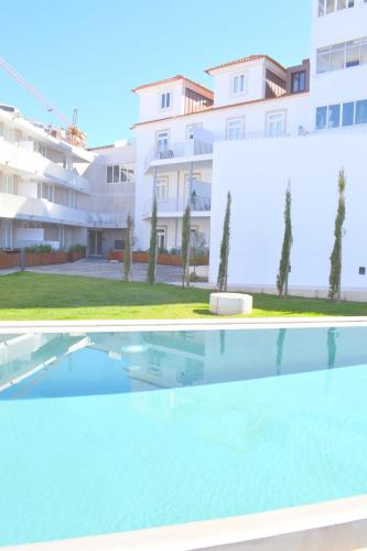 a swimming pool in front of a building at TP AURA 19, Swimming Pool, Terrace & View in Lisbon